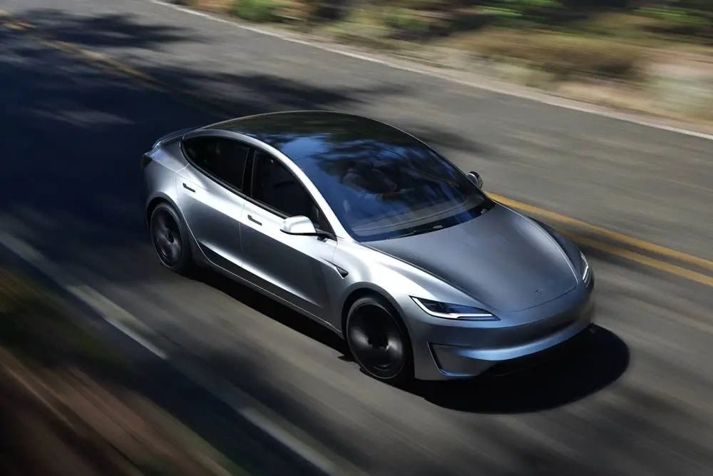 Silver sedan on the road, representing the automotive market