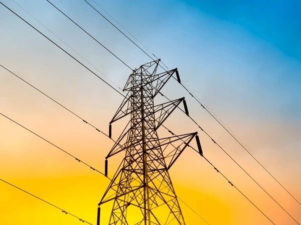 High-voltage transmission tower, representing the electrical market