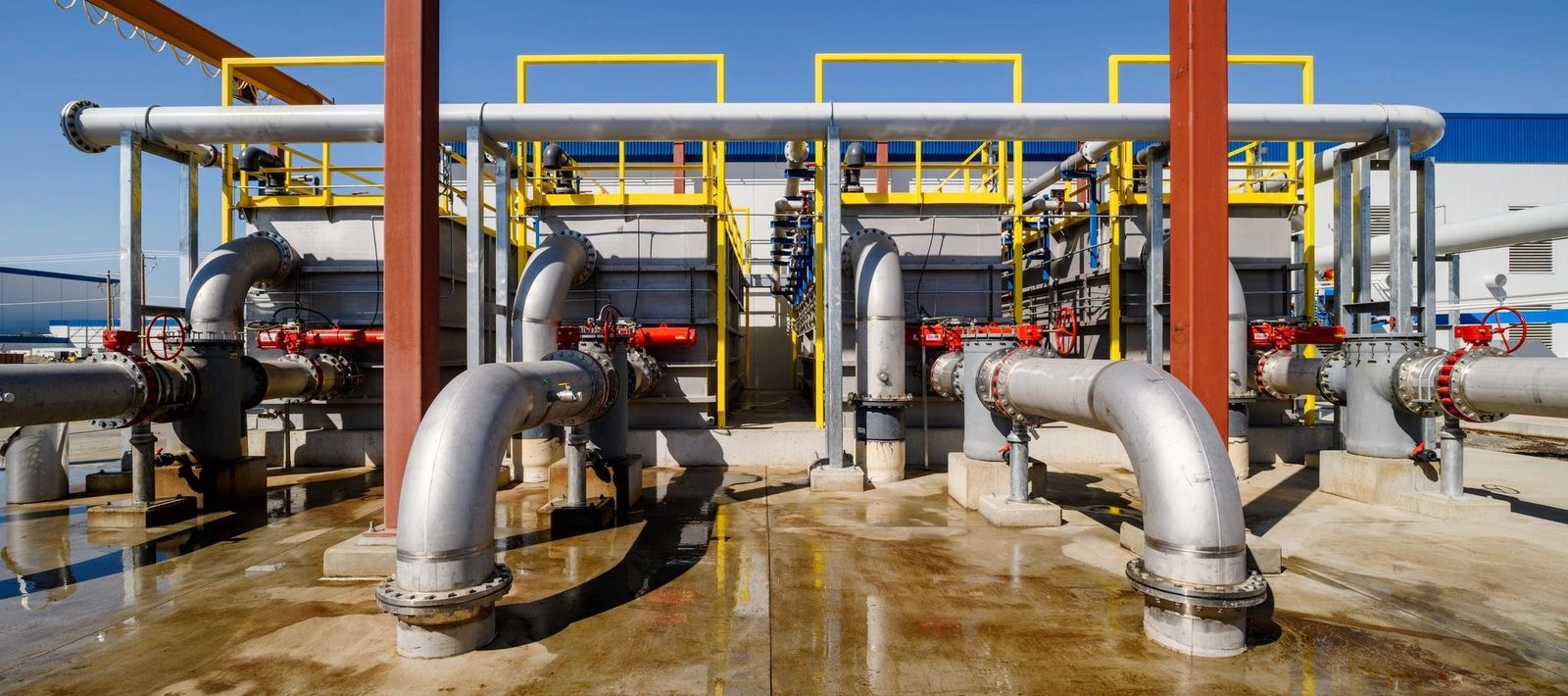Industrial plant piping and valves, representing the industrial market